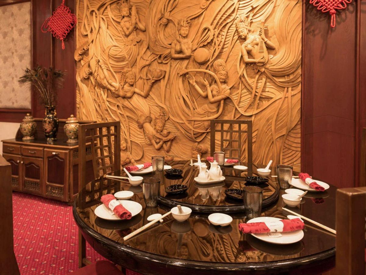 Hotel Mercure Alger Aeroport Maison Blanche Bagian luar foto A table set for dim sum